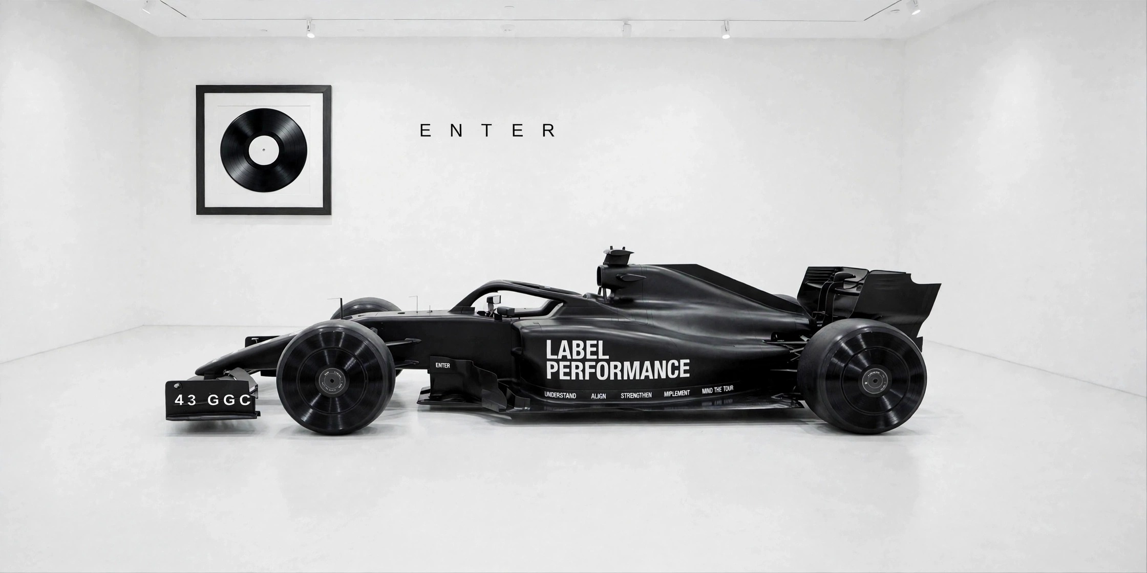 The all-black Label Performance Formula One car in a white gallery